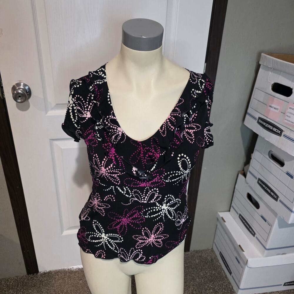 Black work top with butterfly on it